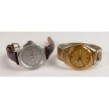 Gents Accutron day date wristwatch: and a Fossil day date watch watch. (2)