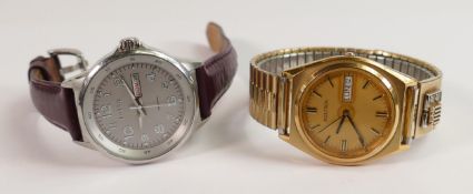 Gents Accutron day date wristwatch: and a Fossil day date watch watch. (2)