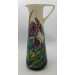 Moorcroft purple iris jug: Collectors club piece dated 1996. Height 24cm , seconds in quality