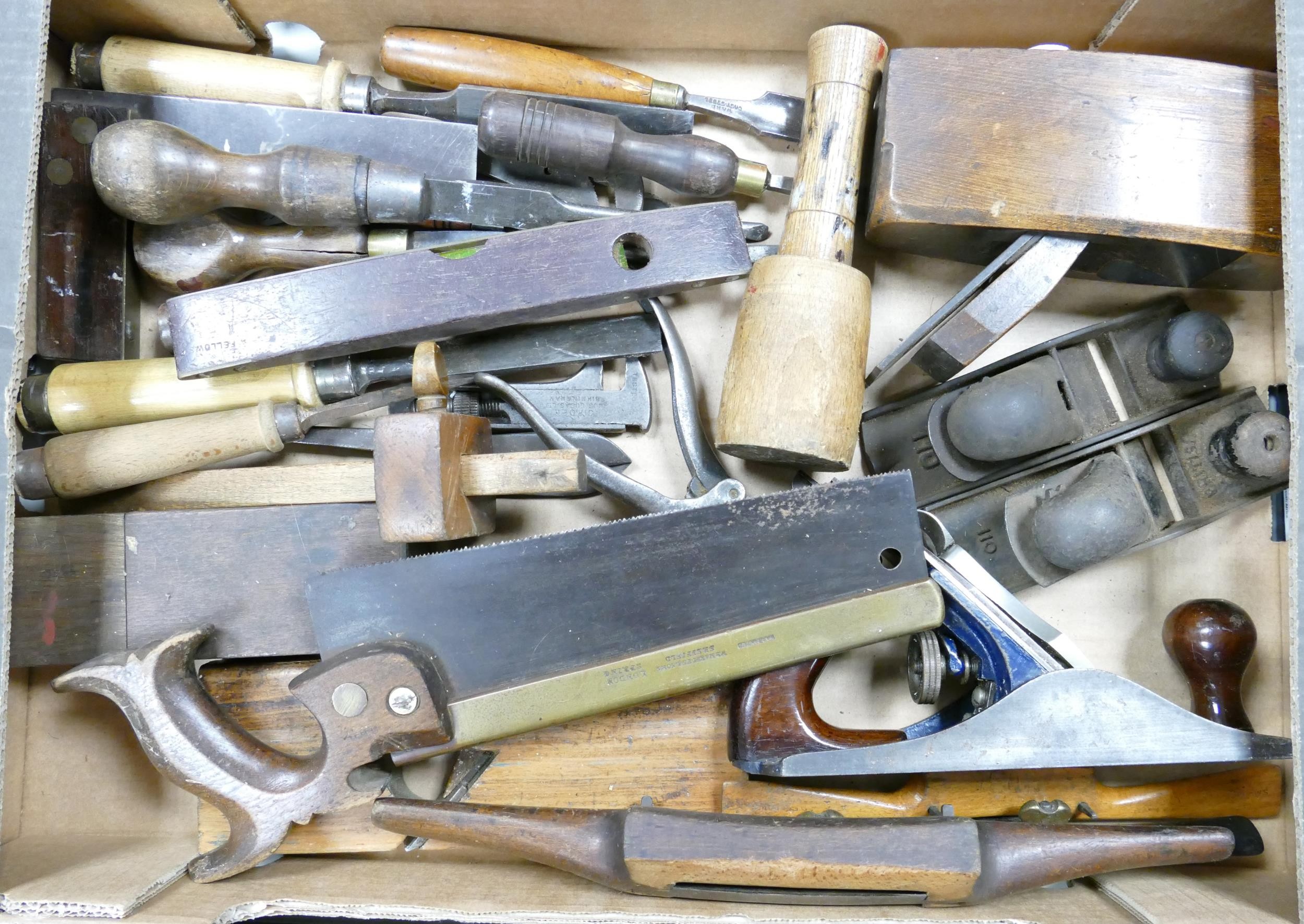 A collection of vintage wood working tools to include saws.planes, chisels etc