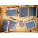 A collection of Silver photo frames in various shapes and sizes (7)