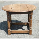 A small Oak georgian style rotating top drop leaf table. 49cm Tall