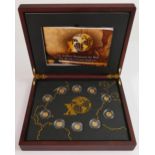 A cased gold coin set, Top 10 explorers of the world: 10 fine gold proof coins each 0.5g, in