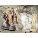 A collection of hand carved figures, busts and similar