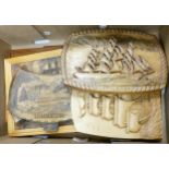 A collection of hand carved panels and plaques