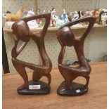 Two African hardwood hand carved stylised figures: tallest 25.5cm in height.