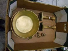 A Brass Jam Pan together with a pair of brass Column form candle stick stands and a graduated set of