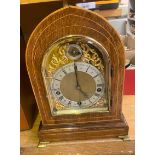 Inlaid Oak Cased Mantle Clock on Brass bracket feet (1 hand is loose and needs re attaching).