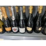 16 bottles of processco and martini sparkling wine