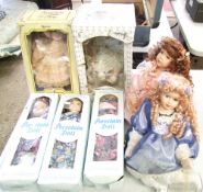 Three boxed porcelain dolls: together with similar dolls