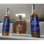 2 bottles of Jules Clairon brandy together with a bottle of kirkland XO cognac.