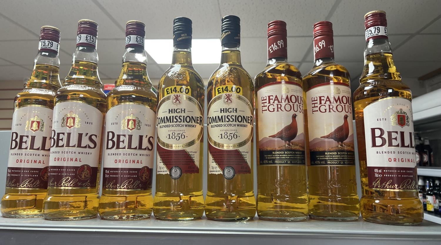 4 bottles of bells whisky together with 2 bottles of famous grouse and 2 bottles of high