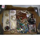 A collection of costume jewelry to include, bracelets, beads, brooches etc