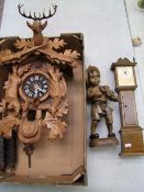 A Wall Mounted Black Forest Type Cuckoo Clock together with Miniature Grandfather clock(a/f) and