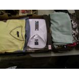 A collection of mens and ladies clothing together with small travel suitcase