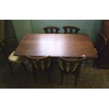 Oak dining table and set of six Ercol dining chairs, table size 75cm x 145cm x 75cm in height.