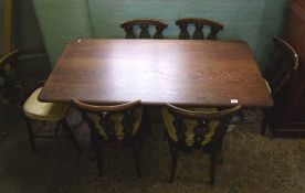 Oak dining table and set of six Ercol dining chairs, table size 75cm x 145cm x 75cm in height.