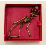 Butler & Wilson costume jewellery dull gold effect diamante crowned skeleton articulated brooch