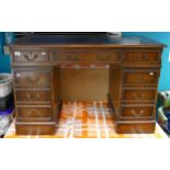 Reproduction mahogany pedestal 9 draw desk: with leather top, w120 x d61cm.