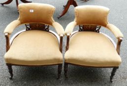 Pair of Edwardian marquetry inlaid upholstered armchairs on castor wheels