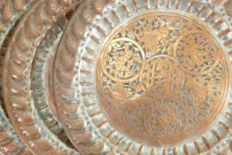 Three early 20th century heavy hand beaten Copper plates: diameter of each 37cm. (3)