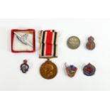 A collection of military related badges and medals: Including a medal For Faithful Service in the