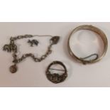 Silver jewellery including charm bracelet, brooch and bangle, 47.6g. (3)