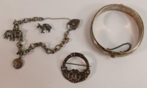 Silver jewellery including charm bracelet, brooch and bangle, 47.6g. (3)