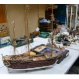 A model of a pirate ship together with a small viking boat. Length of largest 100cm, height 89cm