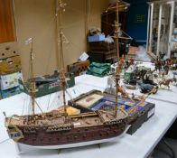 A model of a pirate ship together with a small viking boat. Length of largest 100cm, height 89cm