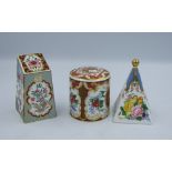 Three floral Spode paperweights with gold stoppers.