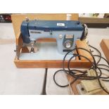 Vintage 'new home' cased electric sewing machine with instructions