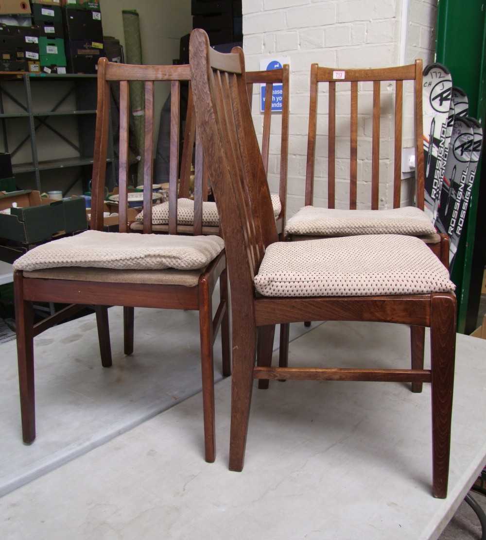 Set of four oak stick back dining chairs