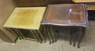 2 x nest of 3 tables, one set in oak, one set with glass insert tops.
