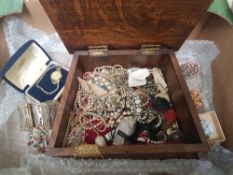 A collection of vintage costume jewellery, watches, brooches etc, contained in a shaped oak