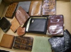 A mixed collection of Wallets, purses and Cigarette cases mostly with crocodile/ alligator leather