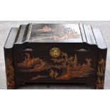 A 20th century Chinese carved camphor wood blanket chest, decorated with fisherman, width 94cm,