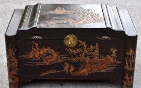 A 20th century Chinese carved camphor wood blanket chest, decorated with fisherman, width 94cm,