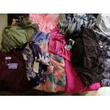 A quantity of ladies plus size dresses and tops