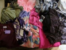 A quantity of ladies plus size dresses and tops