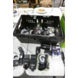 A large collection of camera accessories including ring flashes, wireless remotes, filters, hoods,