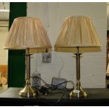 A pair of modern metal column table lamps with shades