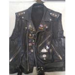 Vintage leather waistcoat with vintage pin badges