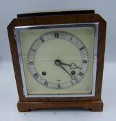 An Elliot of London Walnut cased mantle clock with pendulum and key