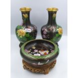 Pair of floral noire cloisonné vases on hardwood stands together with matching bowl Height of vase