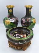 Pair of floral noire cloisonné vases on hardwood stands together with matching bowl Height of vase