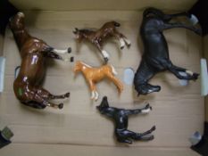 A collection of Beswick horses, Black Beauty and foal, shire foal, brown gloss horse with ear a/f