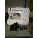 Singer sewing machine model 8280 with cover