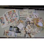 A large collection of loose World stamps and stamp albums (Viewing highly recommended).