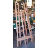 2 large wooden easels.